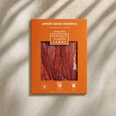Sobre de Jamón Gran Reserva (jamón serrano) Enrique Tomás loncheado (sobre al vacío) fondo piedra