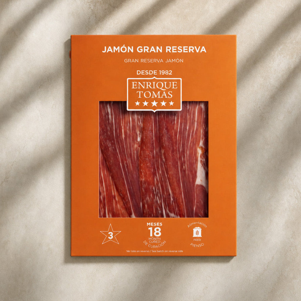 Sobre de Jamón Gran Reserva (jamón serrano) Enrique Tomás loncheado (sobre al vacío) fondo piedra